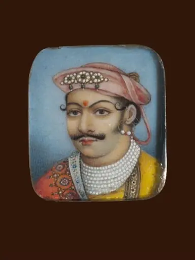 A wooden panel containing ten ivory miniatures, formerly mounted in two bracelets, depicting Indian rulers.