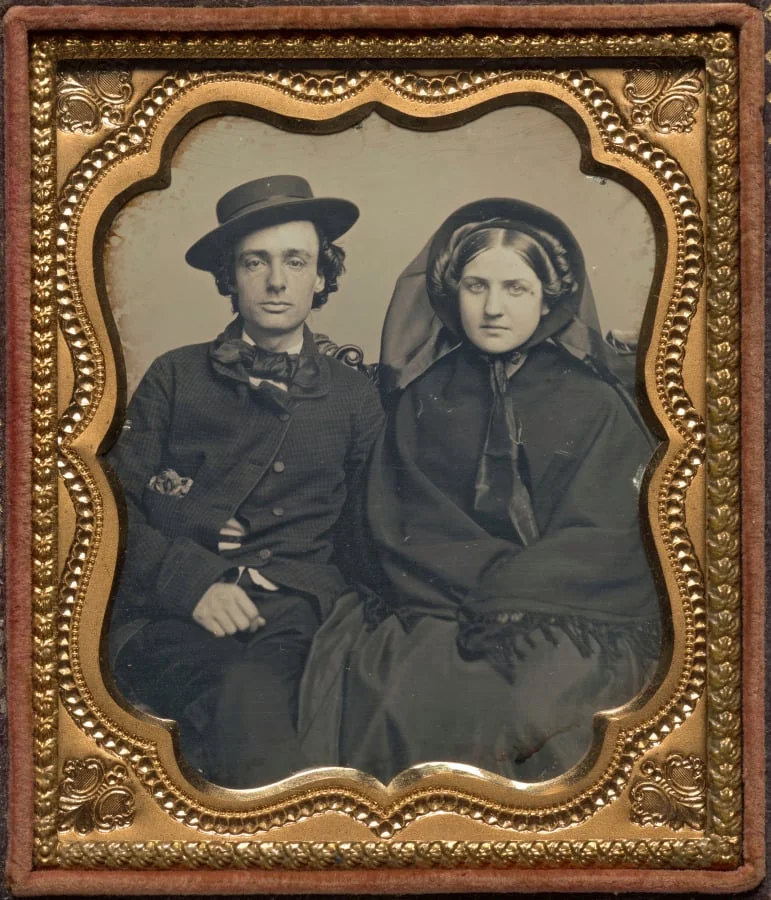 Seated couple in mourning attire, by Unknown, 1857