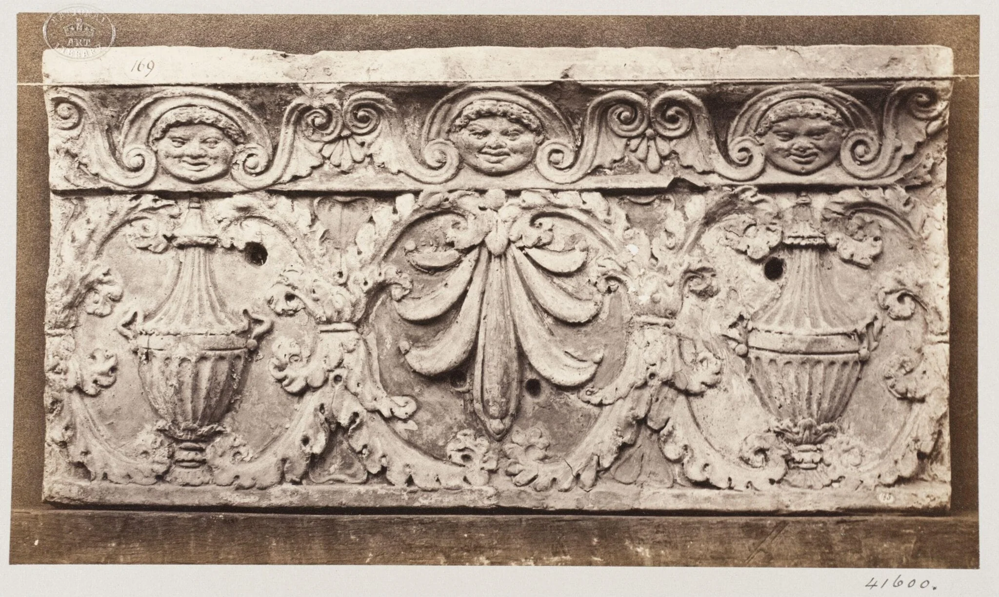 Bas-relief of portion of frieze with acanthus ornament enclosing vases and honesuckle in terra cotta, by Louise Laffon, photographic, 1864