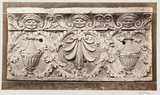 Bas-relief of portion of frieze with acanthus ornament enclosing vases and honesuckle in terra cotta