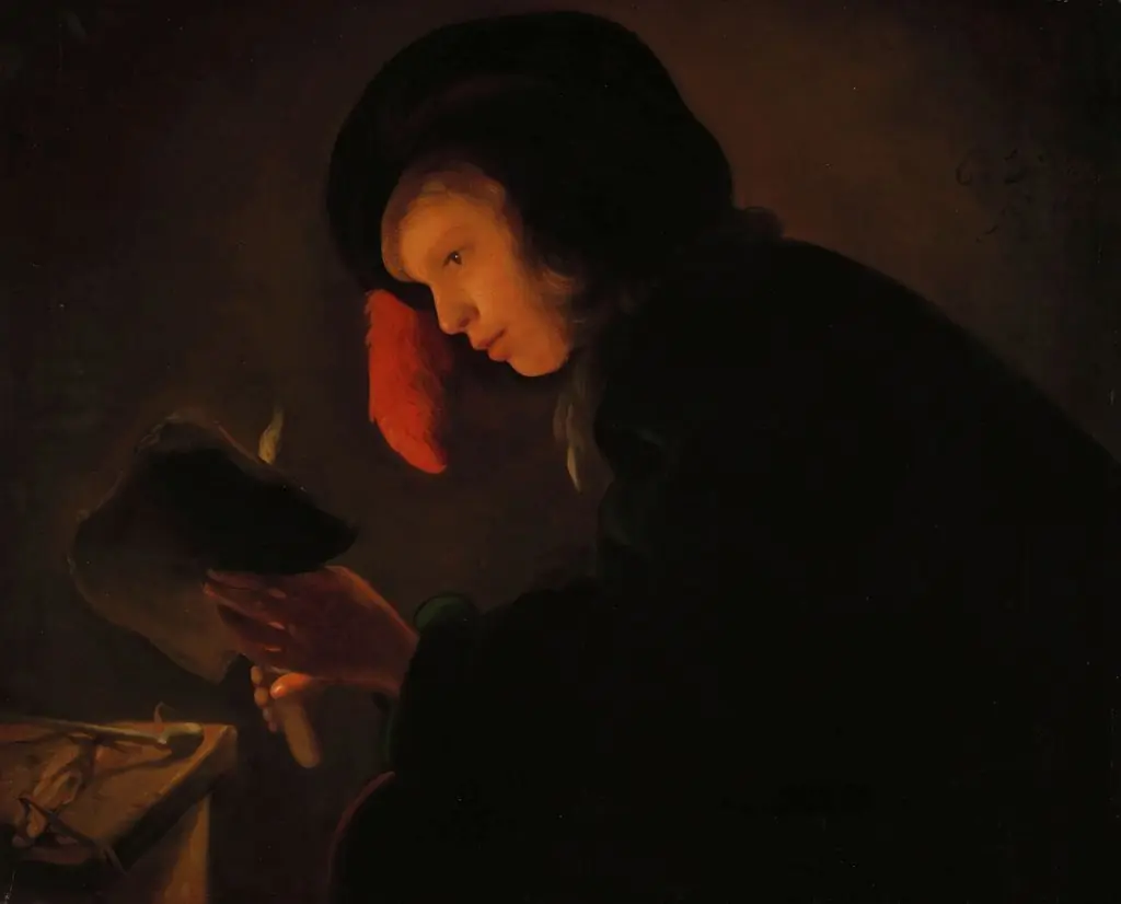 Young man by candle light