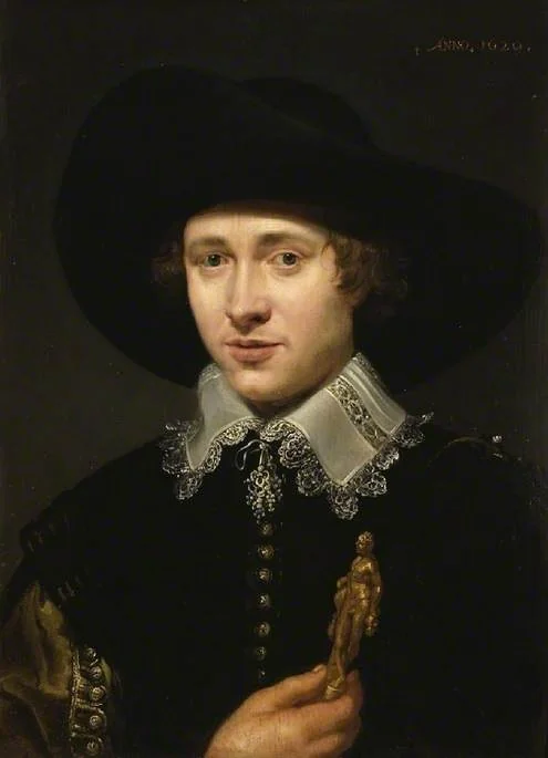 Portrait of a man holding a statuette