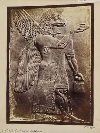 Assyrian sculpture of an eagle-headed genius, worshipping, Paris, Louvre