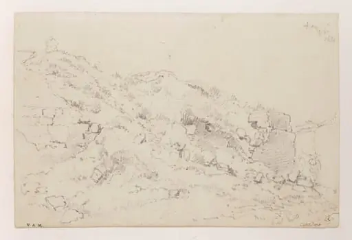 A hillside with ruined masonry