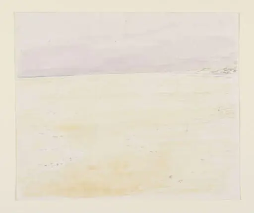 A flat, sandy beach with a purplish sky beyond