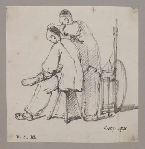 A barber with a seated customer