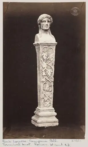 Marble herma with the head of Baccus ornamented with vine leaves and fruit