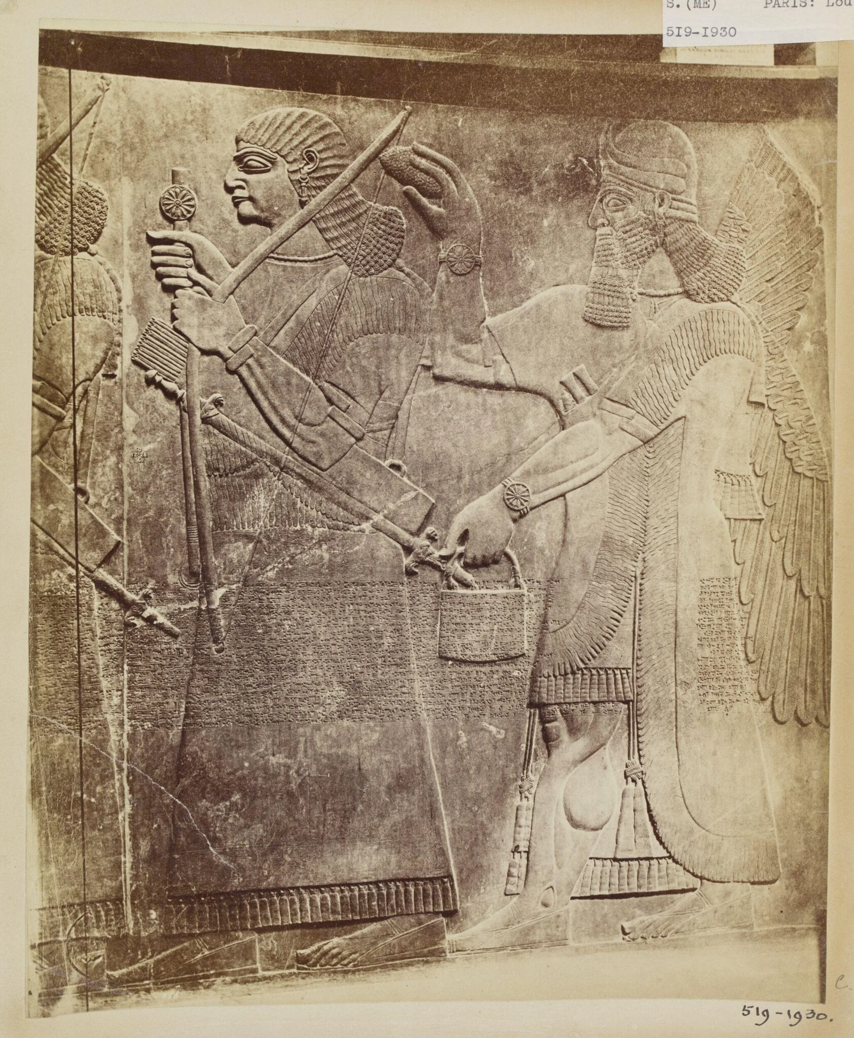 Sculpture depicting a royal Assyrian armsbearer with attendant genius from the period of Ashur-nasir-pal II (885-860 B.C.), Louvre, Paris