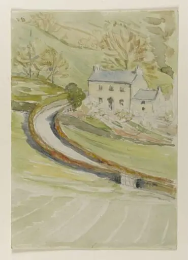 House in a steep-sided valley with a winding road