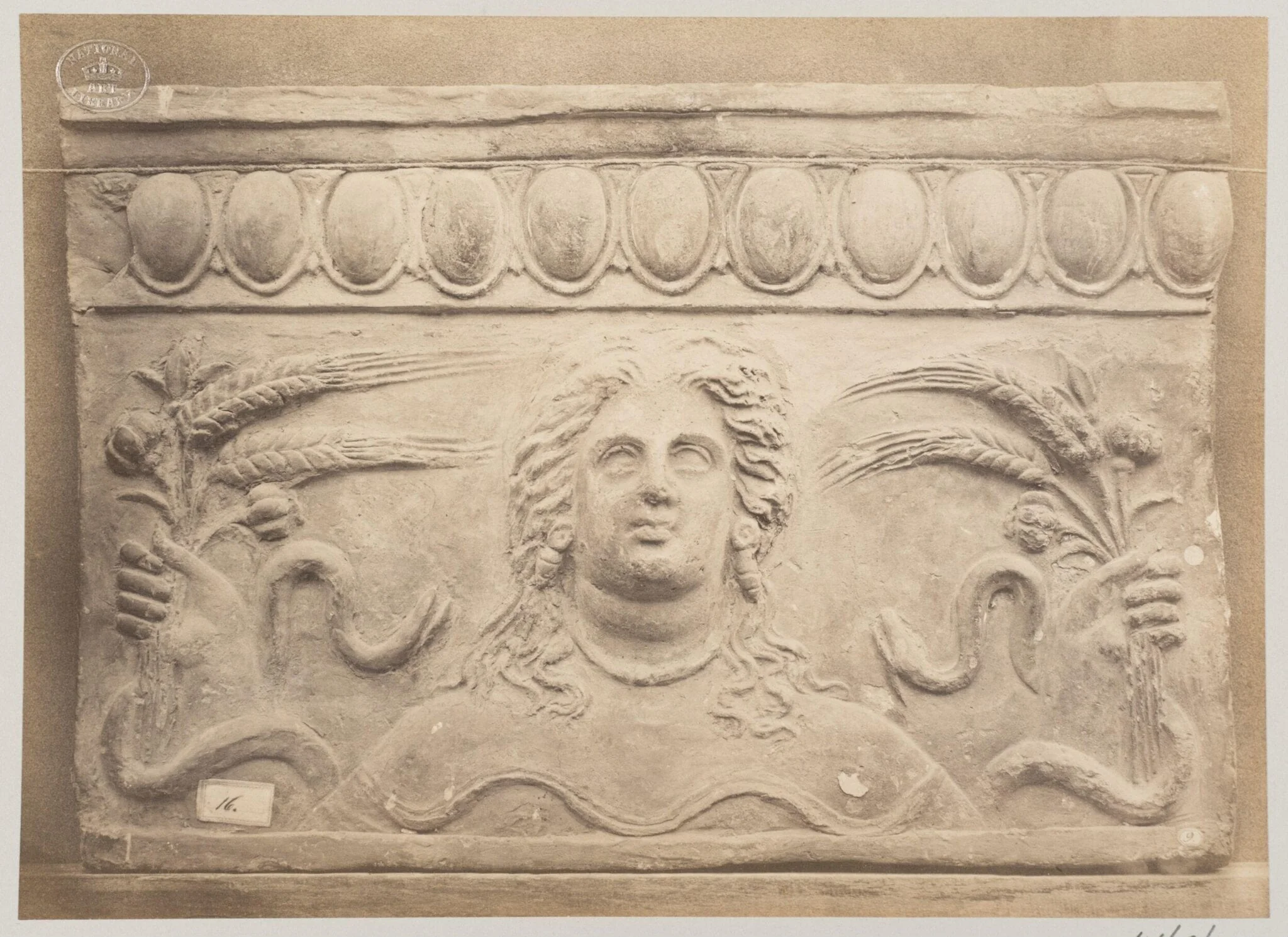 Bas-relief portion of frieze, Bust of Ceres and ears of corn, terra cotta, by Louise Laffon, photographic, 1864