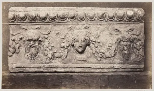 Bas-relief of three baccanalian masques in terra cotta