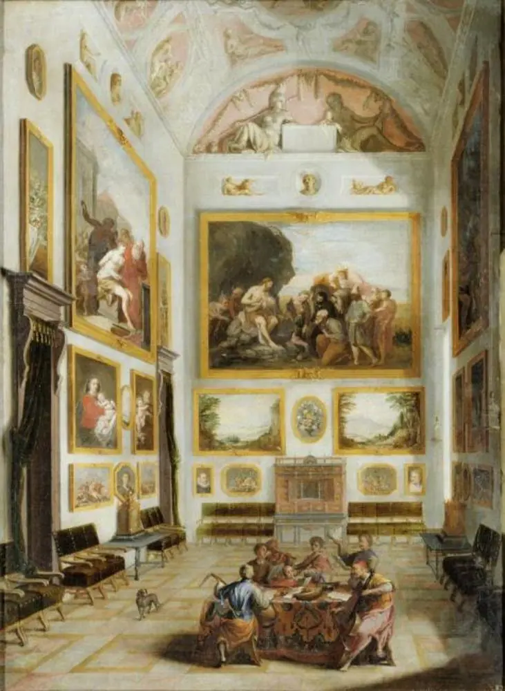 Interior with  a collection of paintings and musicians around a table