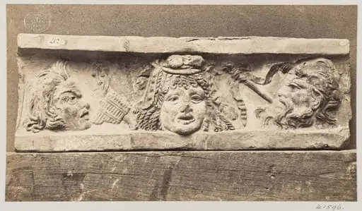 Bas-relief of three masques in terra cotta