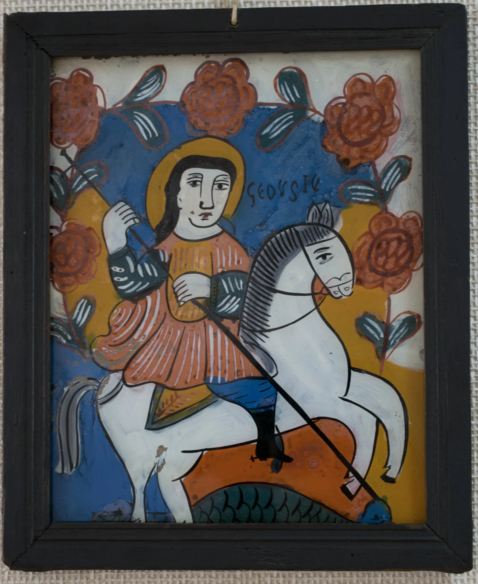 Icoana este pictată "în oglindă", pe un suport de sticlă de formă dreptunghiulară în ax vertical. Tema iconografică: Sfântul Gheorghe omorând balaurul. Sfântul, călare pe cal alb, este plasat în centrul icoanei. Veșminte ostășești, cizme înalte, tunică scurtă, roșie, cu mâneci verzi, pantaloni albaștri, bufanți.Capul descoperit, părul lung, negru, revărsat pe umeri. Aureola trasată cu mâna liberă. În mână ține o suliță lungă pe care o înfige în gura balaurului reptilian, verde, simbolizând zonele inferioare, ale păcatului. În jumătaea superioară o ghirlandă de trandafiri dispusă în arcadă deasupra sfântului. Icoana are caracteristici specifice picturii niculene: stângăcia, simplitatea și primitivismul desenului; compoziția sumară,este mai încărcată totuși decât la icoanele niculene din prima perioadă. Paleta cromatică sobră, culorile intense:alb, orange, roșu, verde, albastru, negru. Rama profilată, de culoare neagră, dosul din scândură subțire de brad.