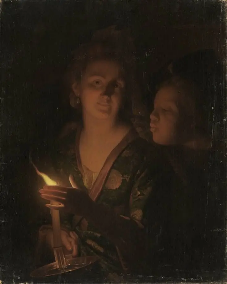 Woman with a candle that a boy tries to blow out
