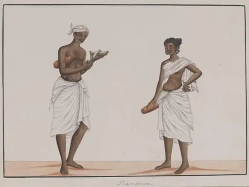 A man and woman carrying rolled mats