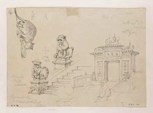 The gateway pavilion at the A-Ma temple, Macau, its guardian lions, and a cat