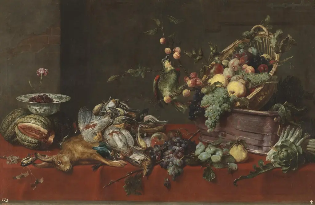 A still life with game, vegetables and fruit on a table, with a parrot on a branch