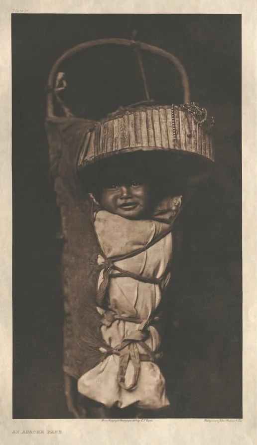 Portfolio I, Plate 17: An Apache Babe, by Edward S. Curtis, 1903