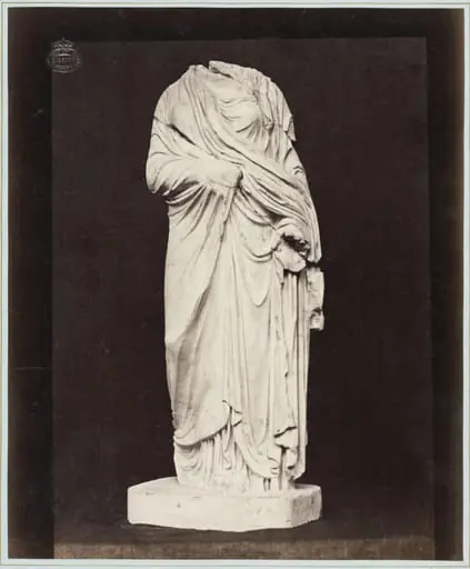 Marble statue of a headless draped figure
