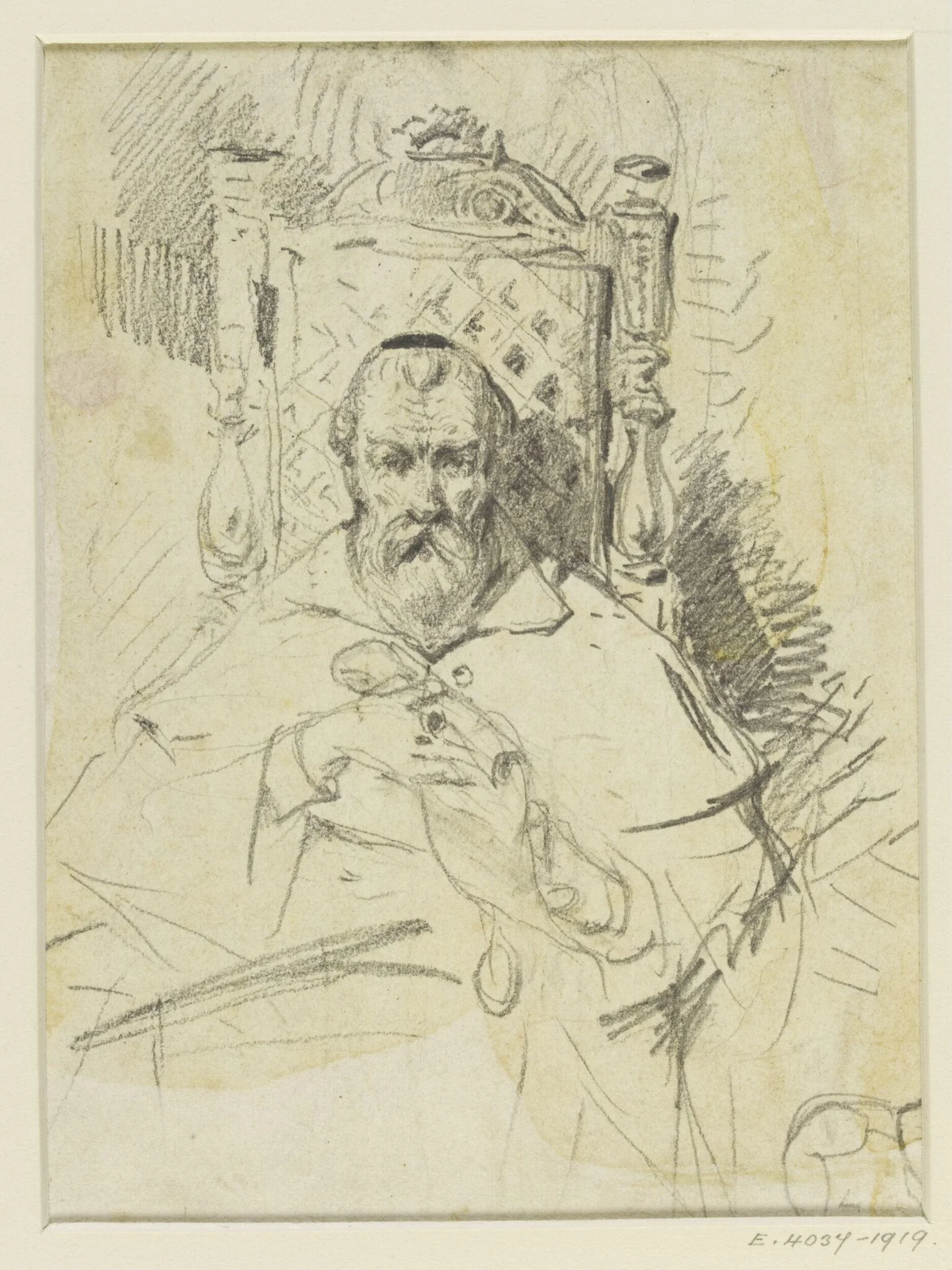 An old man seated in a chair