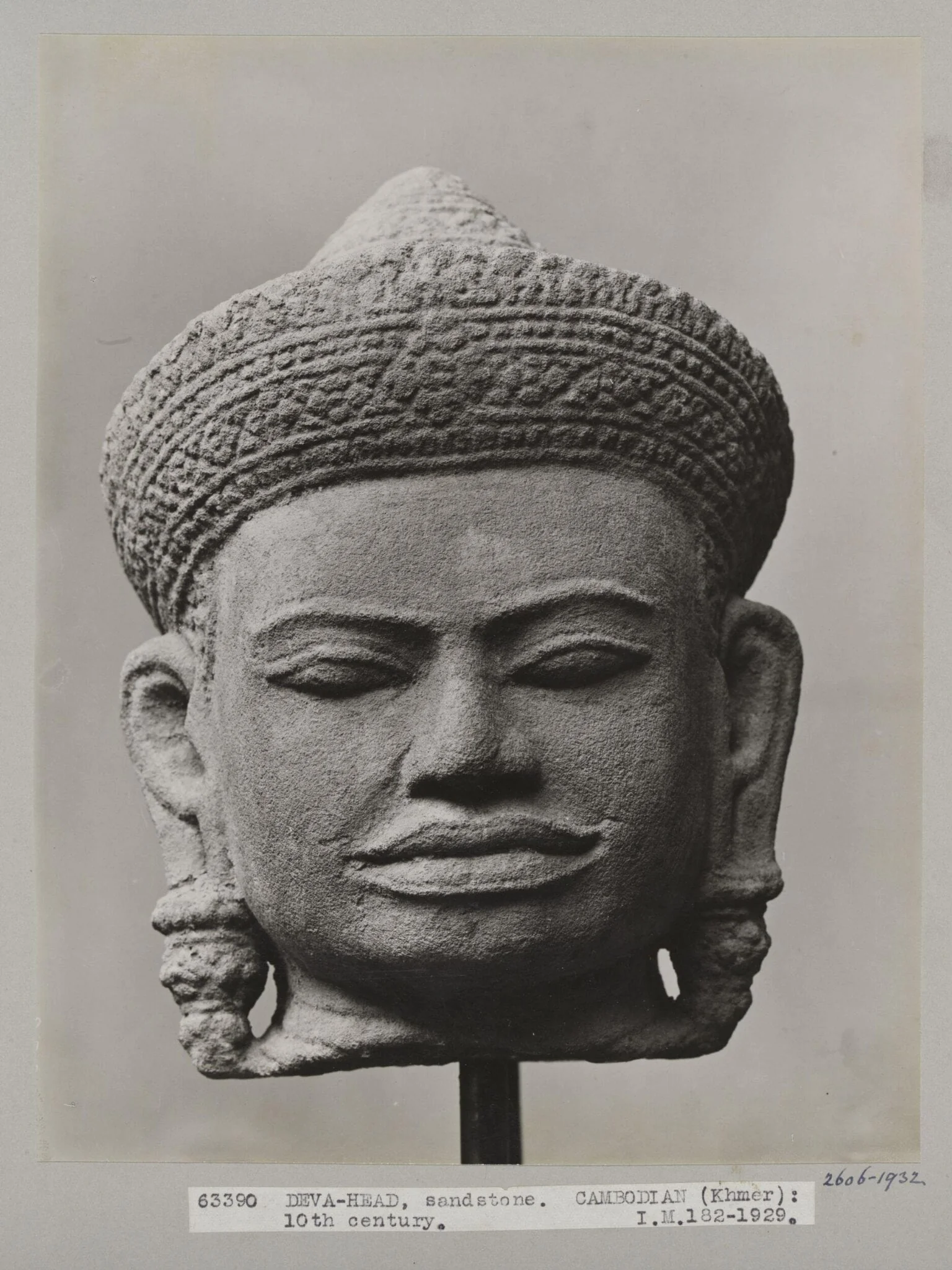 Cambodian sandstone sculpture of head of Deva, 10th century, V&A Museum, London