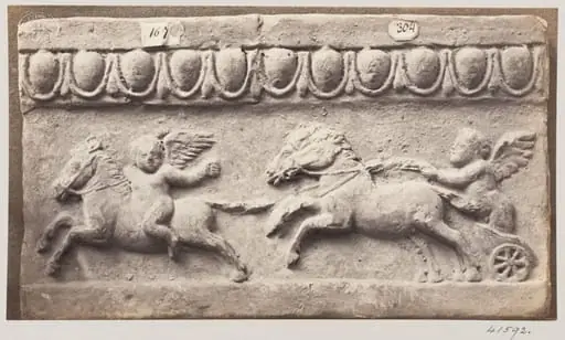 Bas-relief of a portion of a frieze in terra cotta depicting winged cupids and chariot and horses