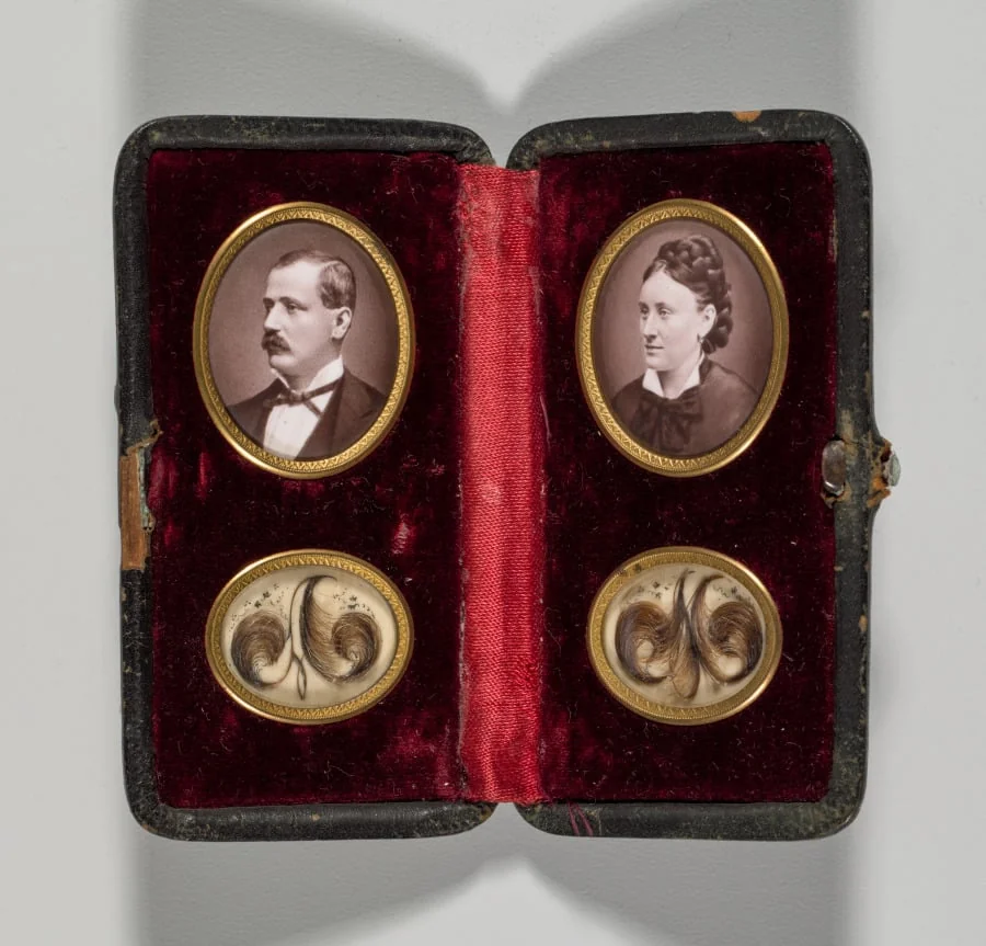 Untitled (Case with portraits of a man and woman and hair ornaments), by Unknown, 1874
