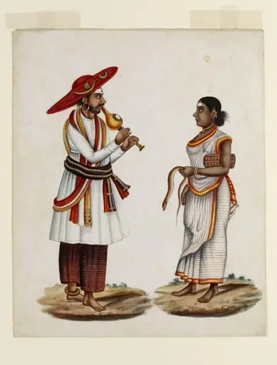 A snake charmer and his wife
