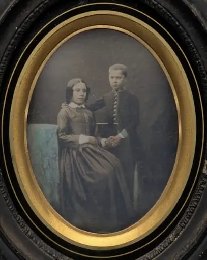 Brother and sister clasping hands