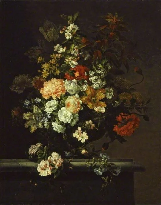 Still life of mixed flowers and a vase on a ledge