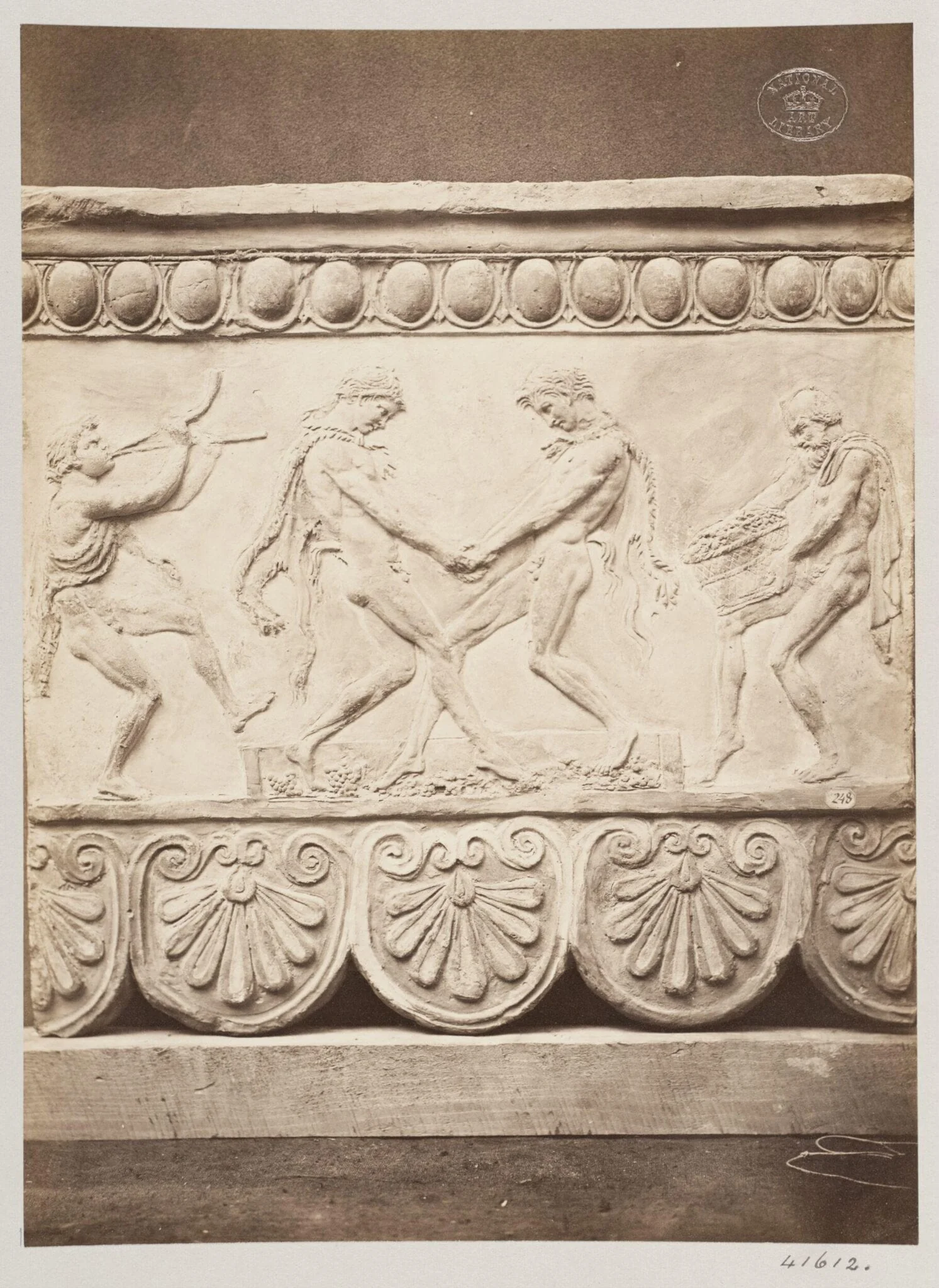 Bas-relief portion of a frieze of Satyrs treading the wine press in terra cotta