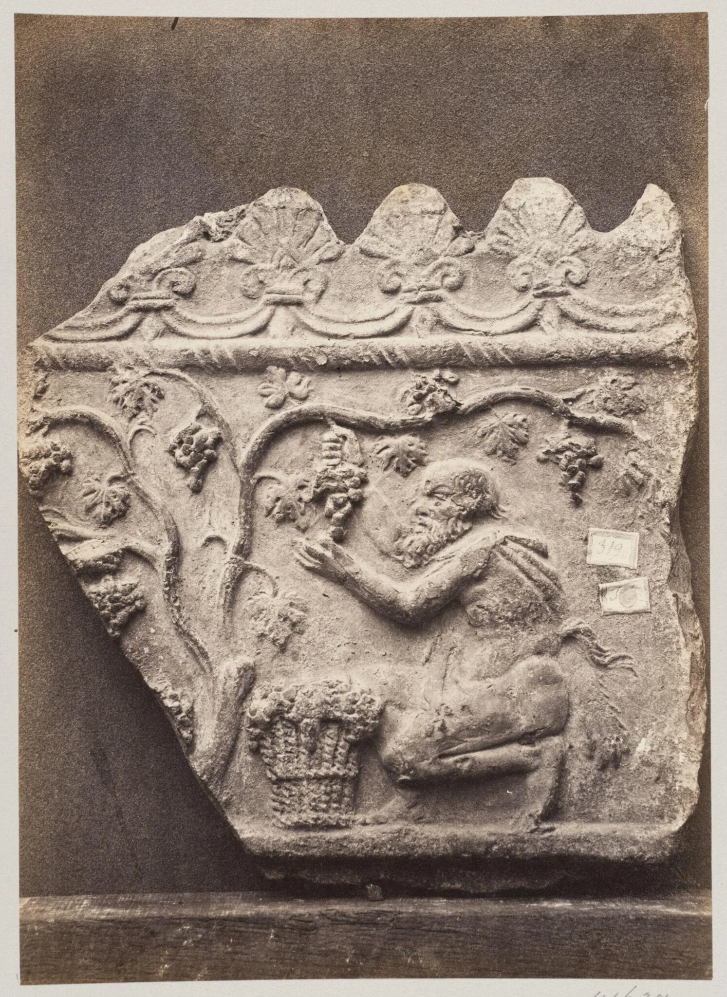 Bas-relief portion of frieze with harvesting satyr in terra cotta, by Louise Laffon, photographic, 1864