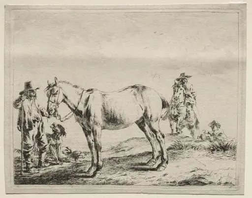 Man holding a horse by the bridle