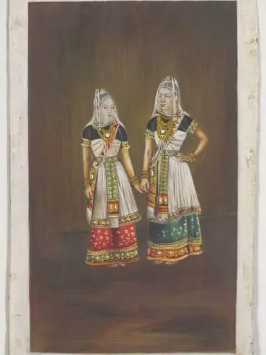 Two Manipuri dancing-girls standing together holding hands.