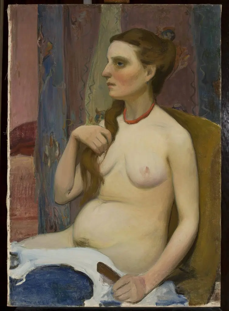 Nude of a woman combing her hair