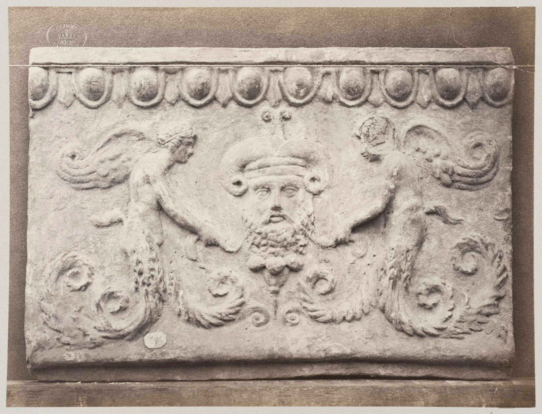 Bas-relief portion of frieze  of masque of Ammon and genii in terra cotta