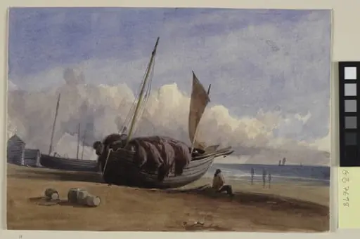 Beached fishing boat with seated fisherman