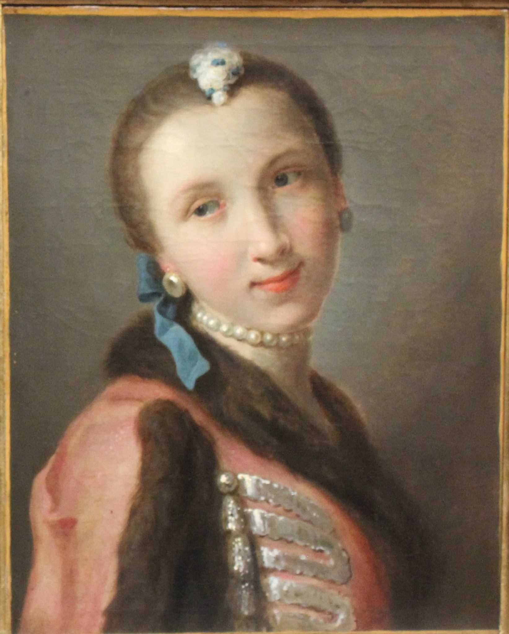 Smiling girl with pearl necklace