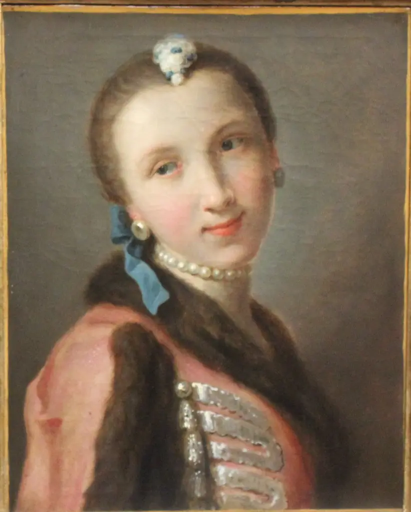 Smiling girl with pearl necklace