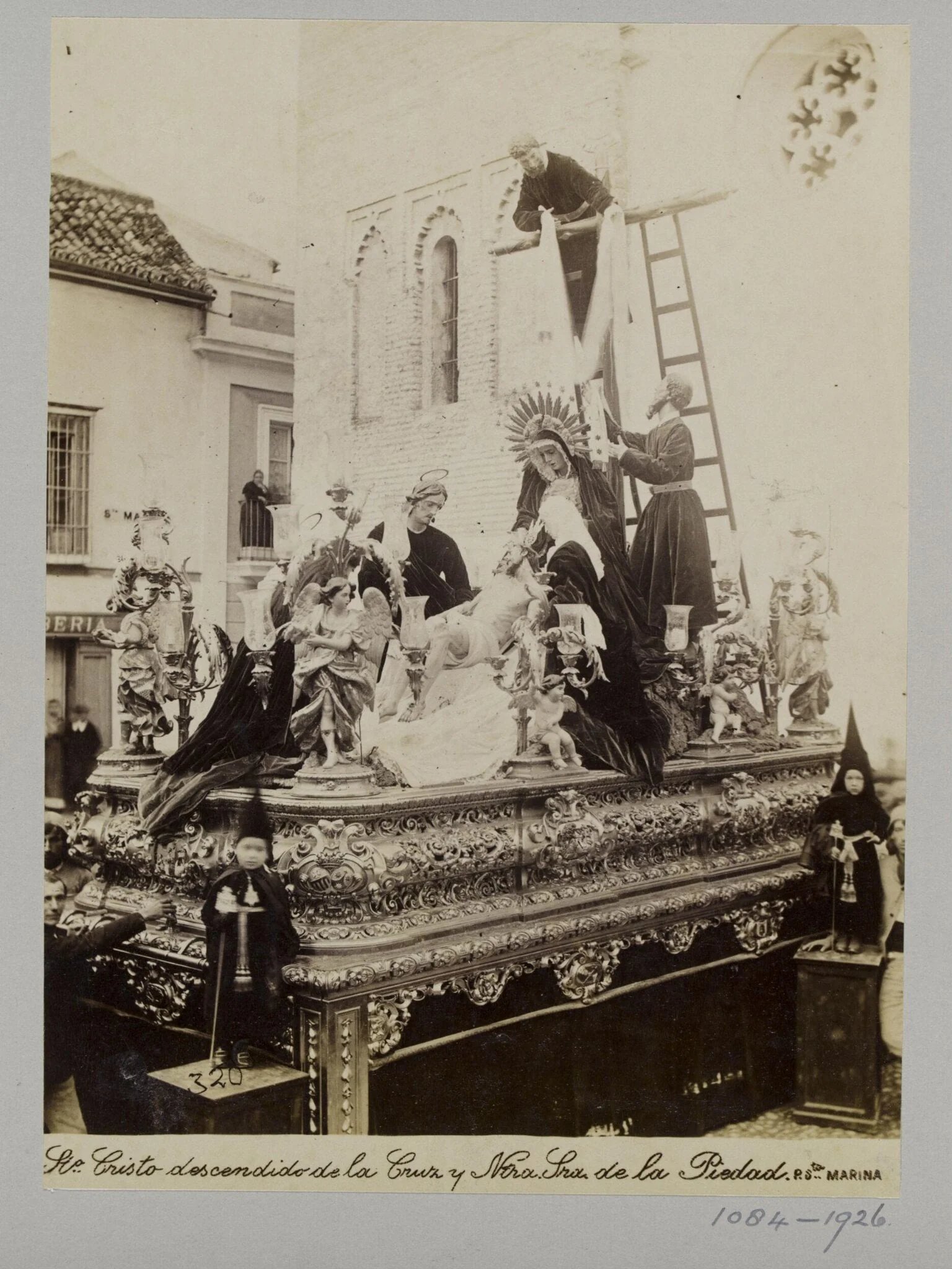 Processional statuary group belonging to the Fraternity of the Parish of Santa Marina, Seville, with children in special dress in the foreground, by Unknown, photographic, 1850