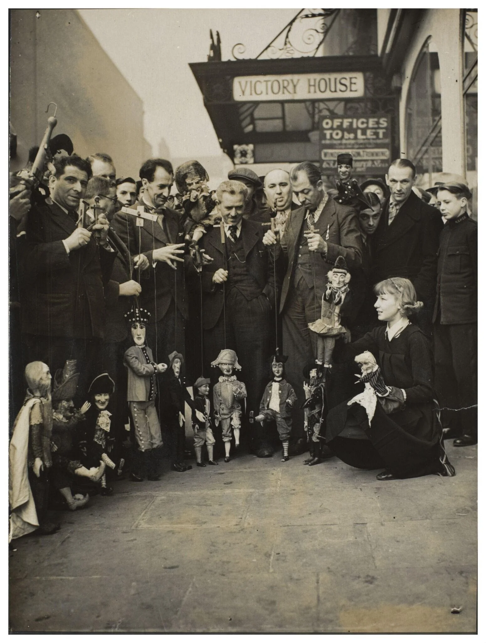 Photograph of puppeteers at the opening of the 13th Exhibition of the British Puppet and Model Theatre Guild, 1938, by Keystone Press Agency Ltd., photographic, 1938