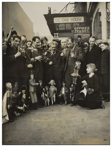 Photograph of puppeteers at the opening of the 13th Exhibition of the British Puppet and Model Theatre Guild, 1938