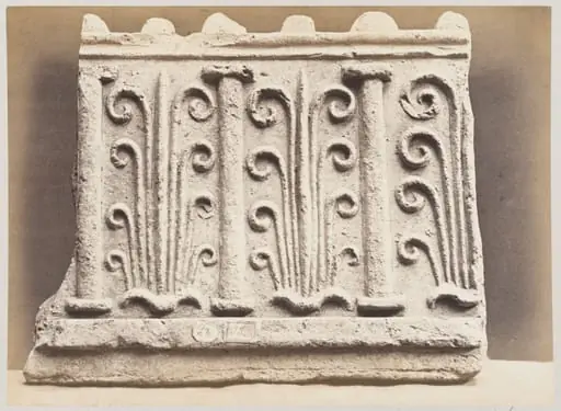 Bas-relief portion of frieze with palmettes and columns in terra cotta