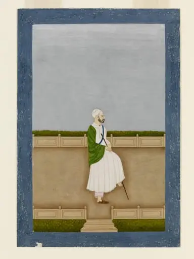 A man in white robe and turban