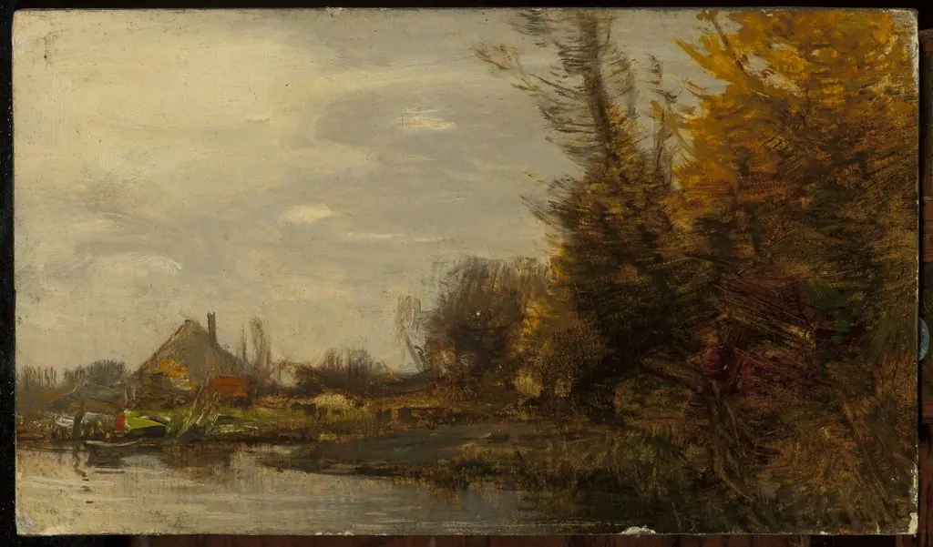 Autumn landscape with a cottage at waterside