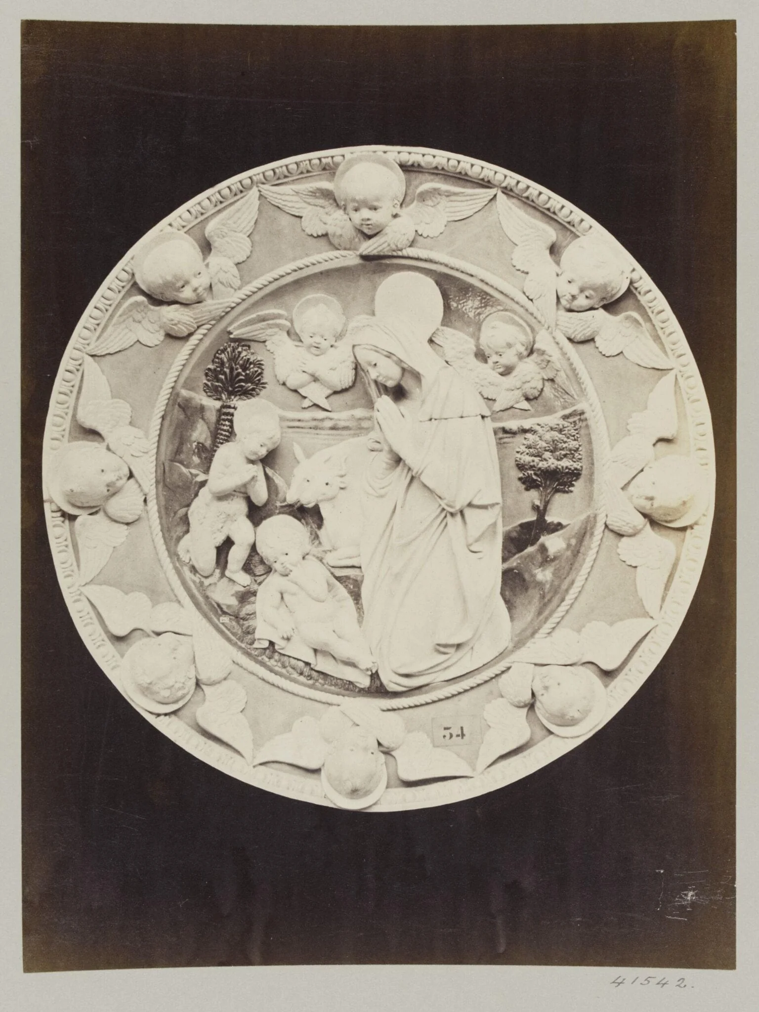 Circular bas-relief depicting the Nativity in enamelled earthenware