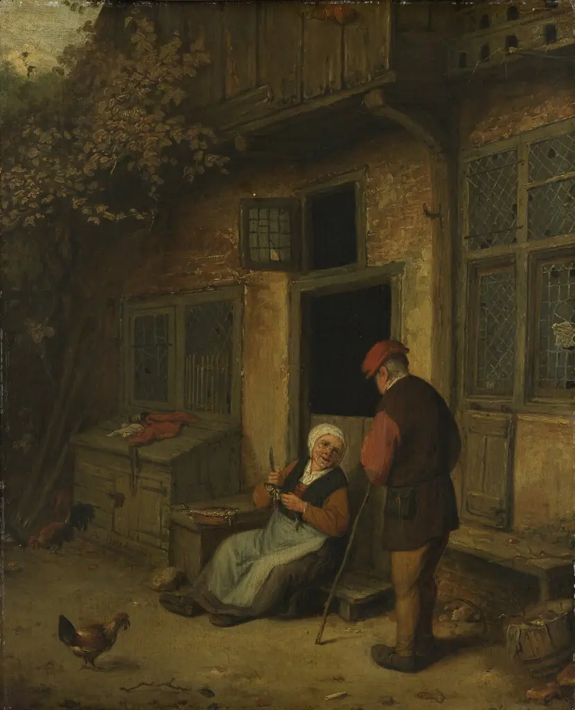A woman gutting herring in front of her house