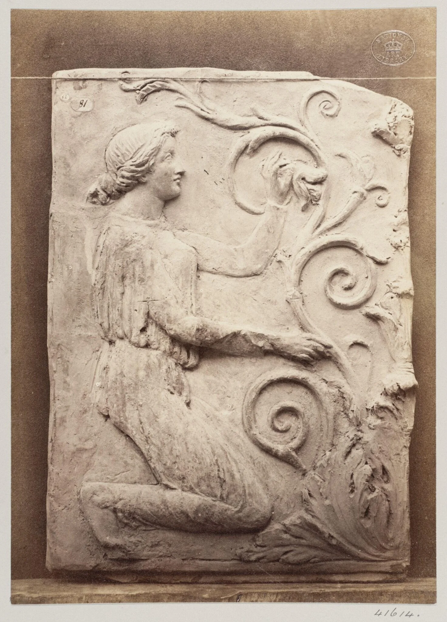 Bas-relief portion of a frieze of a female figure and foliage in terra cotta