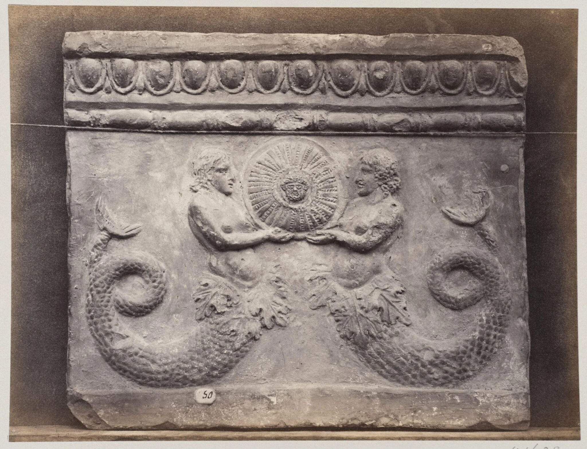 Bas-relief portion of frieze with tritons in terra cotta, by Louise Laffon, photographic, 1864